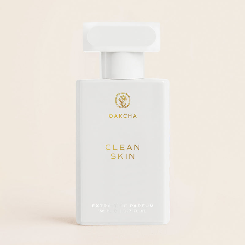 Front view of Clean Skin Extrait de Parfum bottle with gold lettering, 50 mL and 1.7 fl oz, on a neutral background
