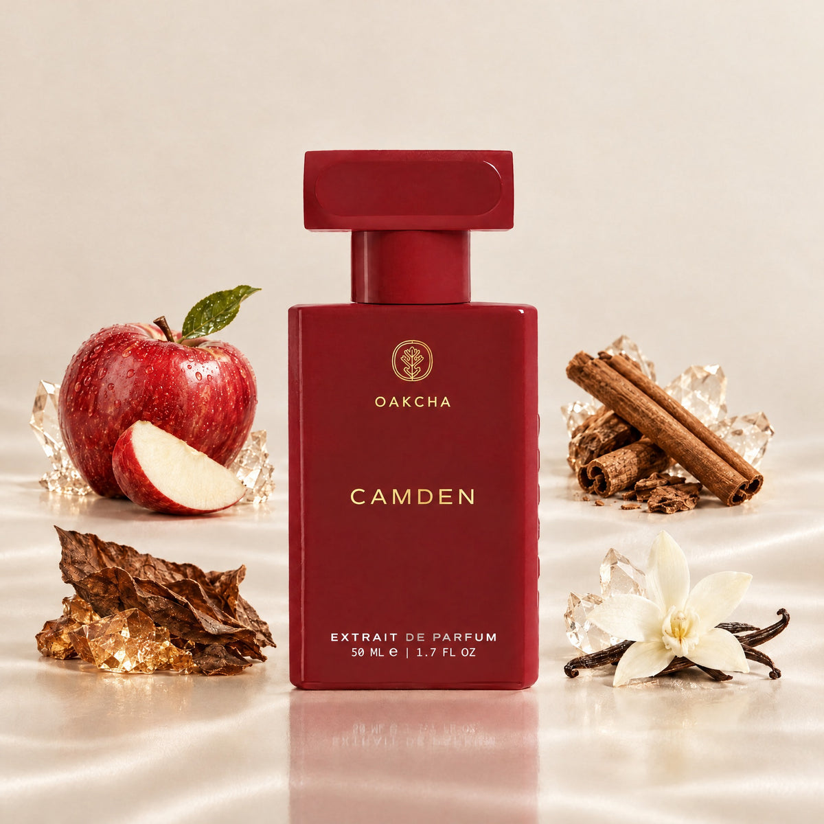Front view of red Camden Extrait de Parfum bottle showcasing apple, cinnamon, tobacco, and vanilla notes on a light background