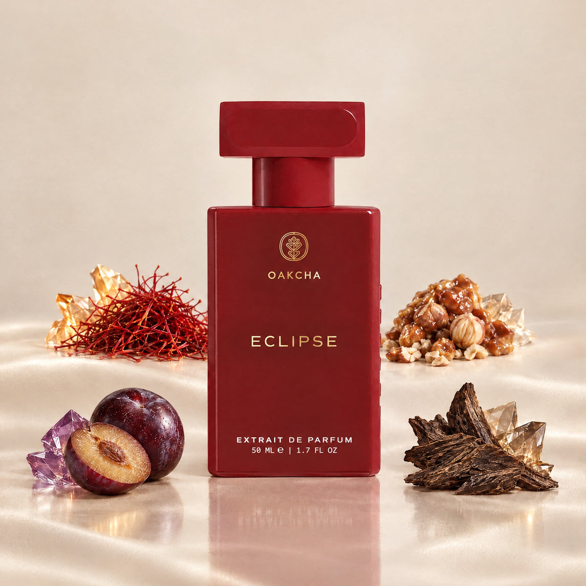 Front view of red Eclipse perfume bottle with 50 ml size, saffron, praline, plum, and oud notes on cream background