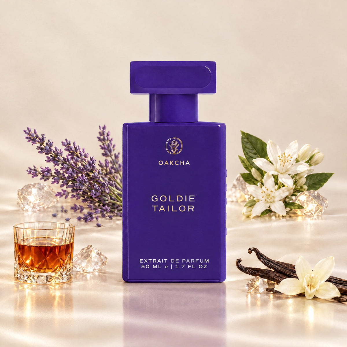 Front view of Goldie Tailor perfume bottle showcasing lavender, orange blossom, vanilla, and rum notes with floral background
