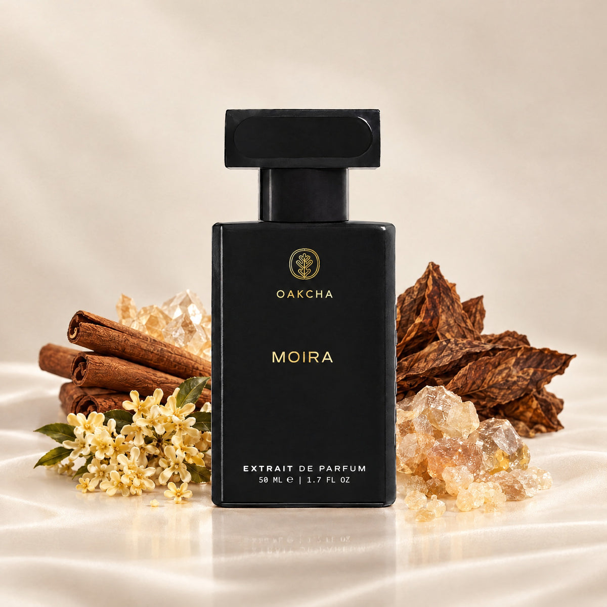 Front view of Moira perfume bottle with cinnamon, tobacco leaf, osmanthus, and frankincense notes on beige background