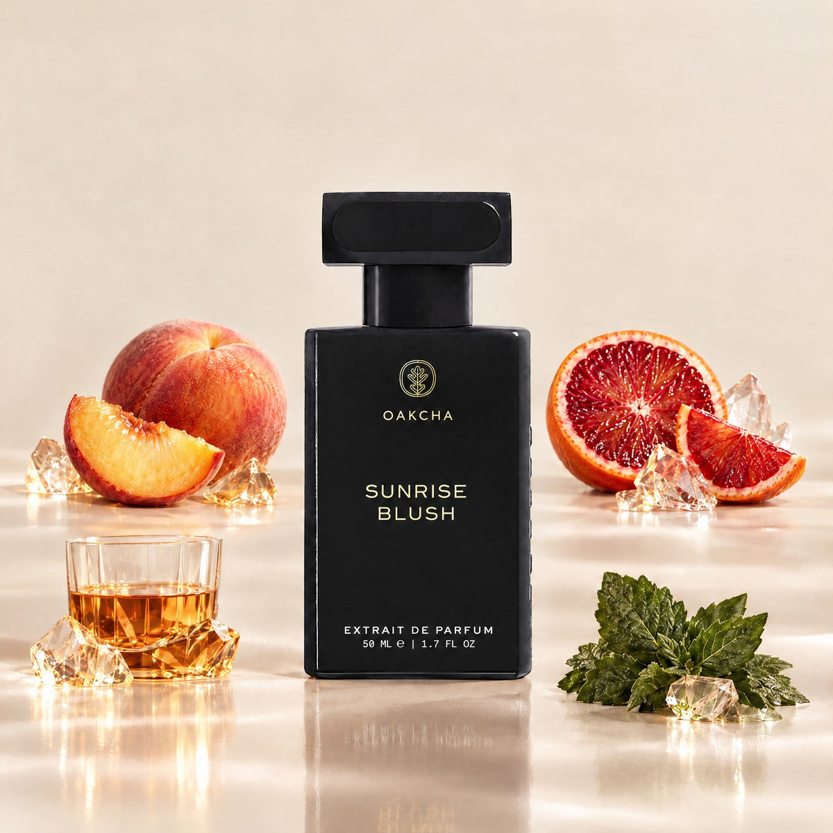 Front view of black Sunrise Blush perfume bottle with peach, blood orange, rum, and patchouli notes on beige background