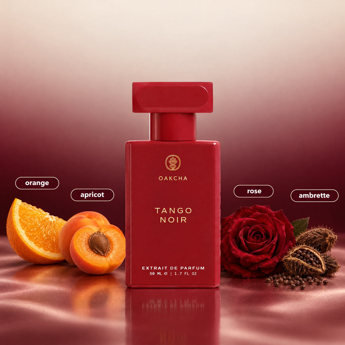 Front view of Tango Noir 50 mL Extrait de Parfum bottle with orange, apricot, rose, and ambrette notes on red satin